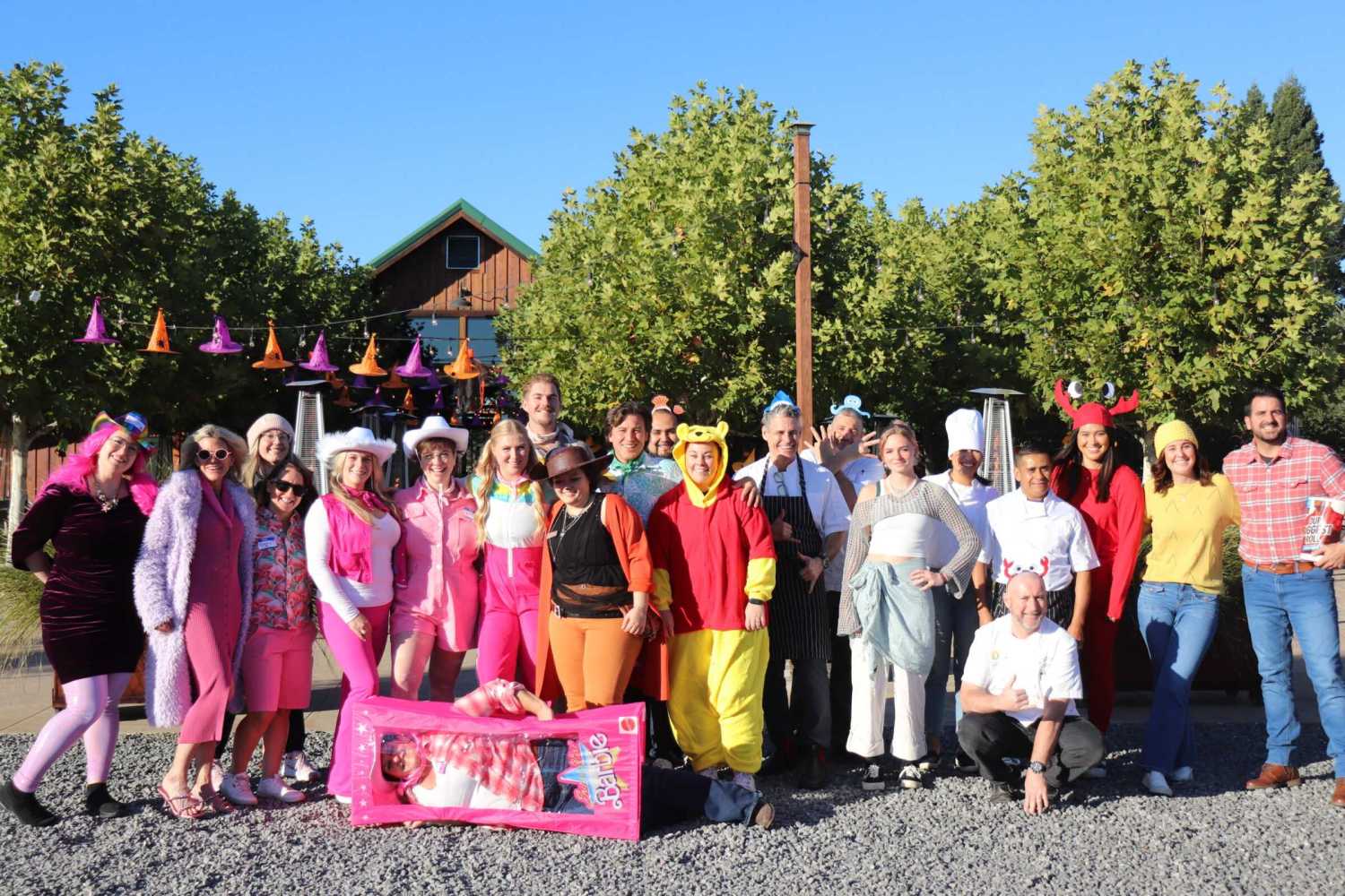 a group of people standing in front of a crowd posing for the camera