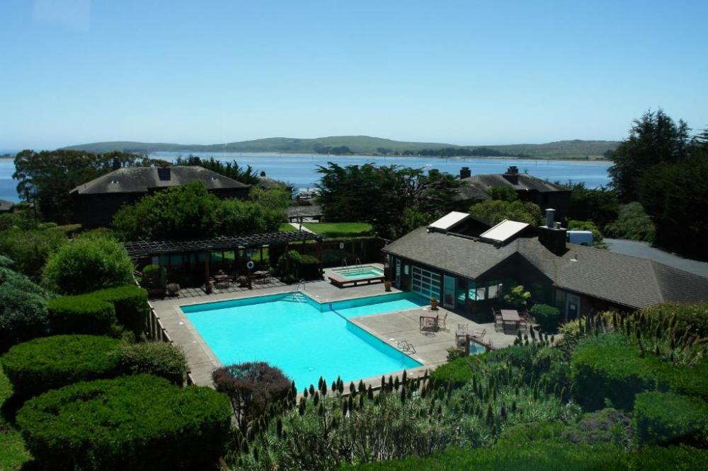 a pool next to a body of water