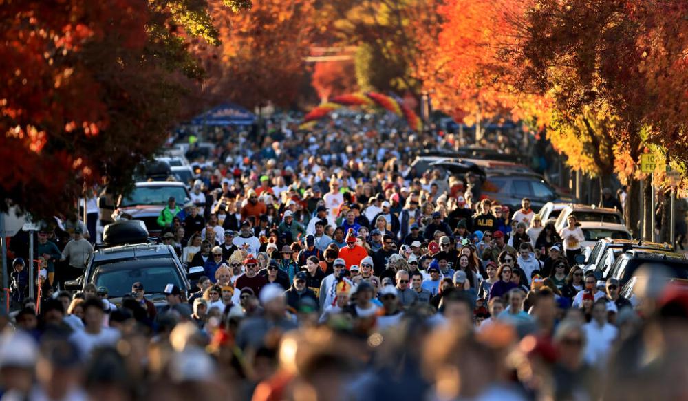 a group of people on a motorcycle in front of a crowd